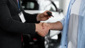 close-up-customer-with-business-person-car-dealership